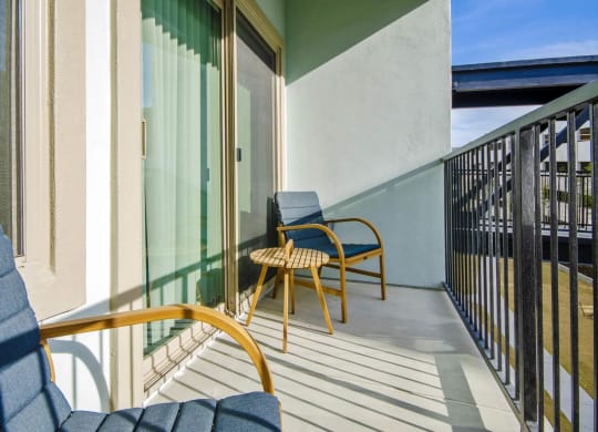 Balcony with chairs at Reveal at Bayside, Texas, 75088