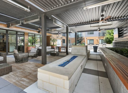 Trellis House apartments outdoor covered, open-air patio with comfortable lounging areas
