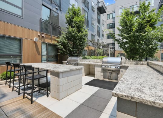 Trellis House apartments outdoor grilling area with al fresco dining