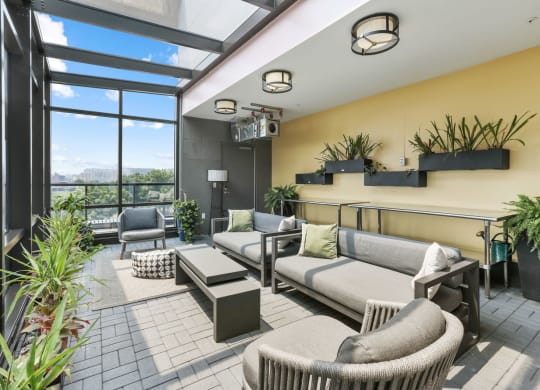 Trellis House apartments social lounging area with breathtaking cityscape views