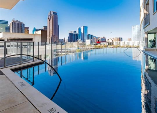 swimming pool with Dallas skyline views at The Gabriella apartments