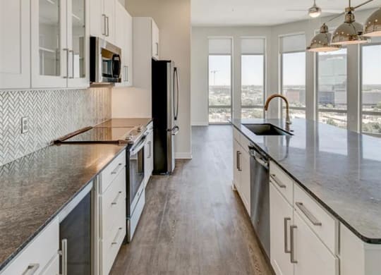 kitchen with granite countertops at The Gabriella apartments