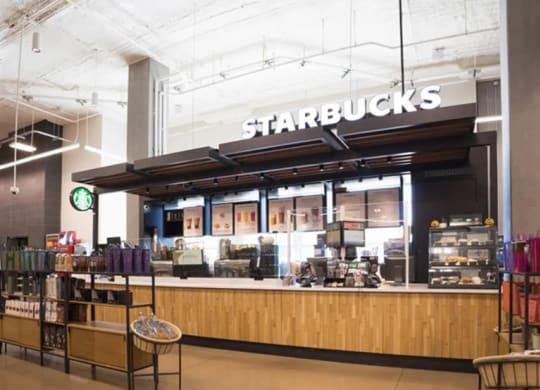a Starbucks store near The Gabriella apartments