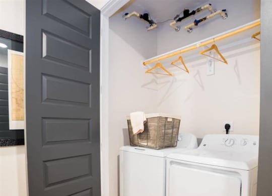 laundry room with washer and dryer at The Gabriella apartments