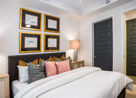 spacious bedroom with a ceiling fan at The Gabriella apartments