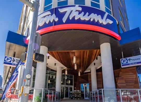 a view of the front of the Tom Thumb store at The Gabriella apartments