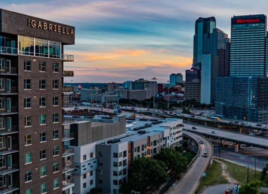 a view of the Dallas skyline near The Gabriella apartments