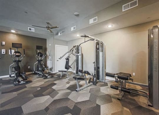 fitness center with strength training equipment at Aspire at 610 apartments