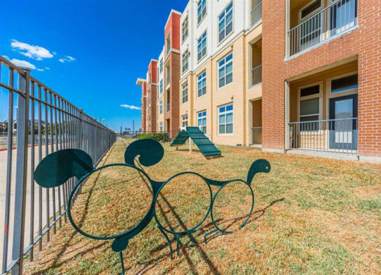 outdoor dog play area at Aspire at 610 apartments