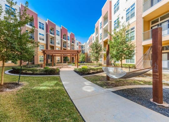 outdoor hammock lounging area at Aspire at 610 apartments