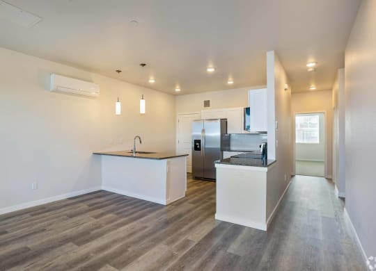 large open kitchen with granite counters at Brownstones at Palisade Park, Broomfield,  Colorado