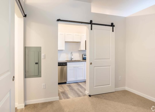 Kitchen view with a sliding door at Brownstones at Palisade Park, Broomfield, 80023