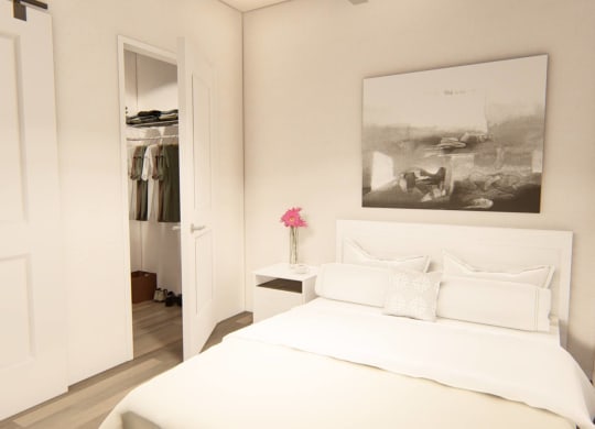 bedroom with large bed and a closet at Brownstones at Palisade Park, Broomfield