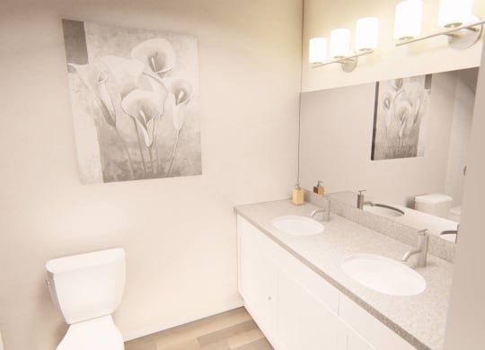 bathroom with two sinks at Brownstones at Palisade Park, CO, 80023