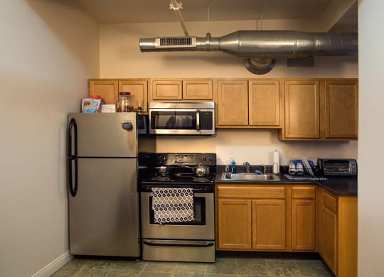 Spacious kitchen with appliances at the Lofts at 5 Lyon, in downtown Grand Rapids, MI