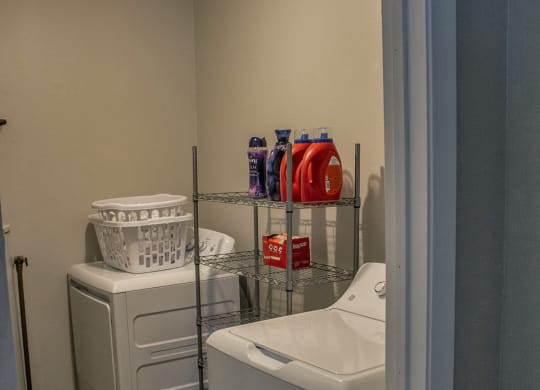 a small laundry room with a washer and dryer