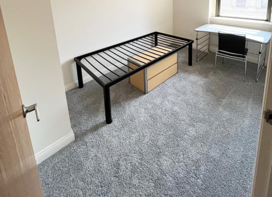 bedroom with bed frame at The Lofts at 5 Lyon, in downtown Grand Rapids, MI