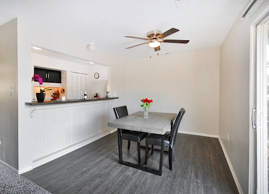 Open-concept living and dining area at Woodcrest Apartments in Westland, Michigan showcasing flexible floor space and contemporary design.