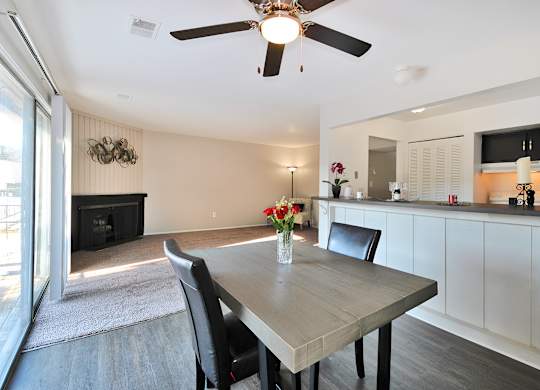 Open-concept living and dining area at Woodcrest Apartments in Westland, Michigan showcasing flexible floor space and contemporary design.