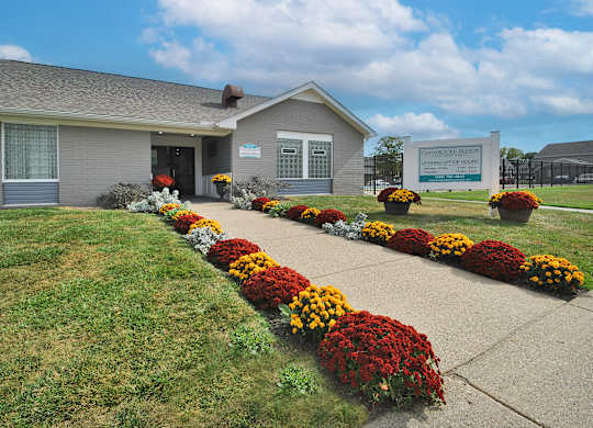Leasing office at Farmbrooke Manor Apartments in Clinton Township MI with welcoming entrance and on-site parking