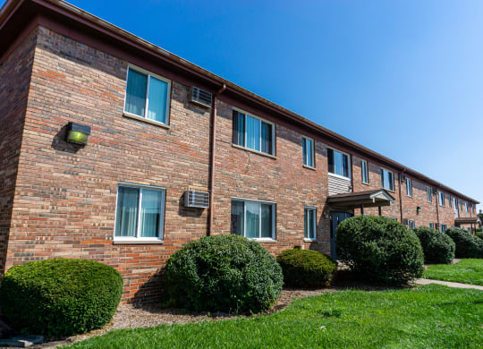 Exterior of apartment entrance at resident only parking at Golf Manor Apartments in Roseville, Michigan
