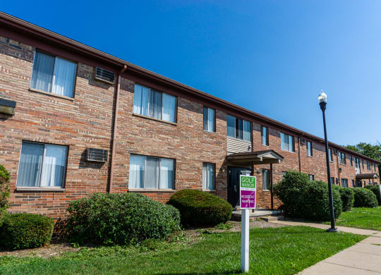 Exterior of apartment entrance at resident only parking at Golf Manor Apartments in Roseville, Michigan