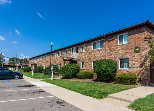 Exterior of apartment entrance at resident only parking at Golf Manor Apartments in Roseville, Michigan