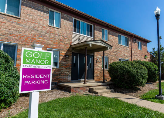 Exterior of apartment entrance at resident only parking at Golf Manor Apartments in Roseville, Michigan
