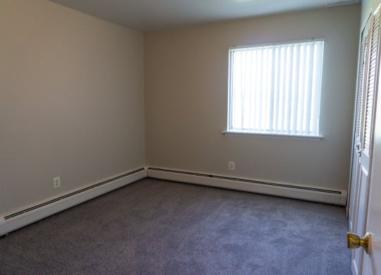 Spacious bedroom at Golf Manor Apartments in Roseville, Michigan
