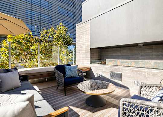 Patio with a couch at K1 Apartments, San Diego