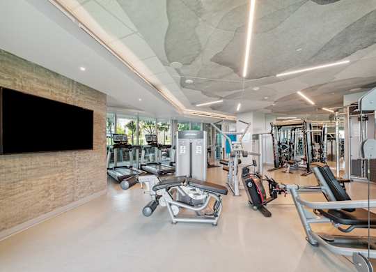 Gym with weights machines at K1 Apartments, San Diego, CA