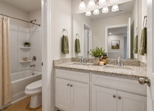 Secondary suite bathroom with a tub and shower combination