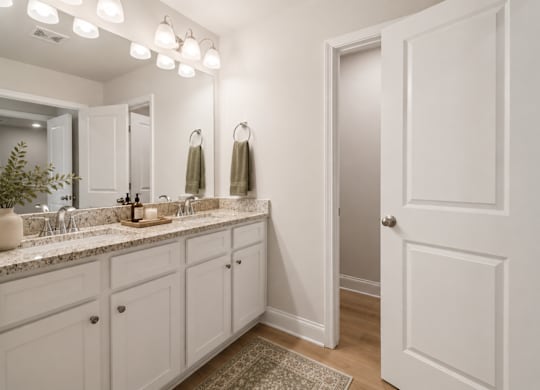 A spacious primary bath featuring dual vanities and ample room for your daily routine.