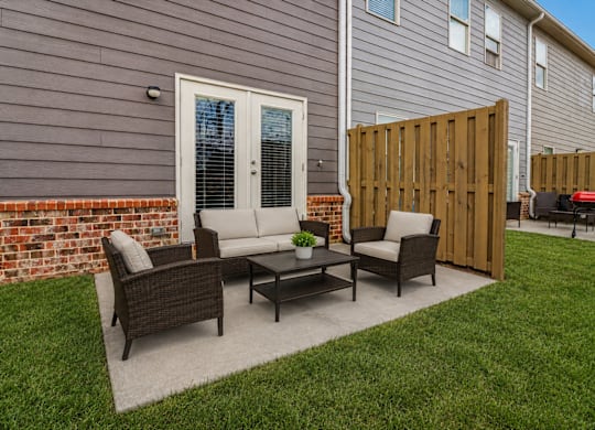 Private outdoor patio with comfortable seating—perfect for relaxing, dining, or enjoying the fresh air.