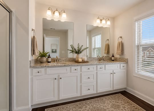 Elegant en suite with a double vanity off the primary bedroom.