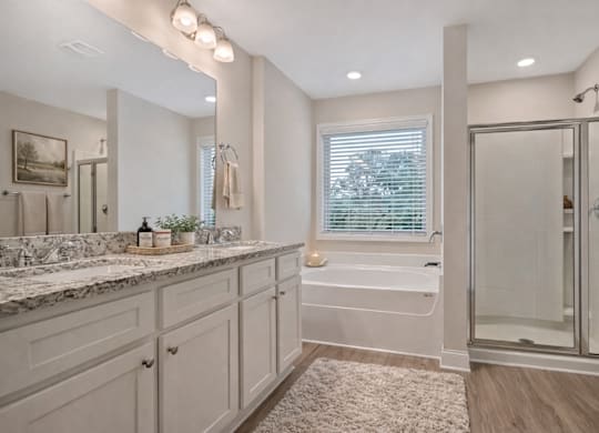Elegant en suite with a double vanity off the primary bedroom.