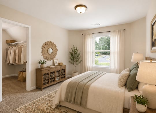 A bedroom with a large bed and a window with curtains.