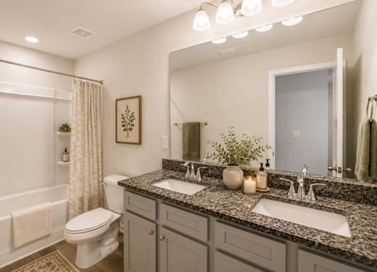 Secondary suite bathroom with a tub and shower combination