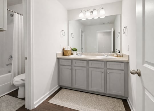 Secondary suite bathroom with a tub and shower combination