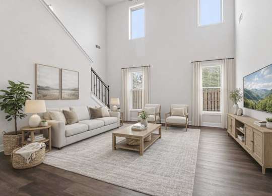 A living room with a white couch, a wooden coffee table, and a painting on the wall.