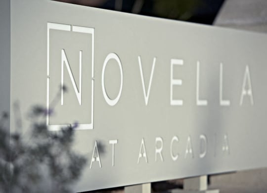 a sign for novella in front of a building at Novella Arcadia, Phoenix, AZ 85018