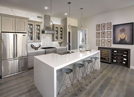 a kitchen with a large island and stainless steel appliances at Novella Arcadia, Phoenix Arizona