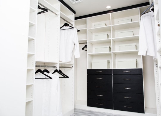a large closet with black drawers and white closets at Novella Arcadia, Phoenix