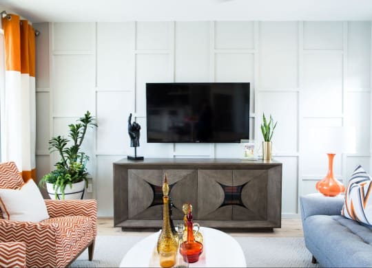 a living room with a couch and a television at Novella Arcadia, Arizona, 85018