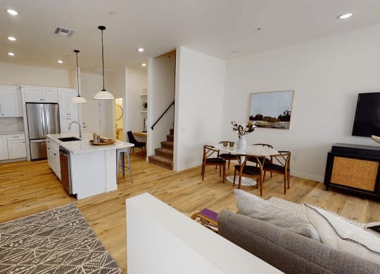 an open kitchen and living room with a dining area and a table at Novella Biltmore, Arizona