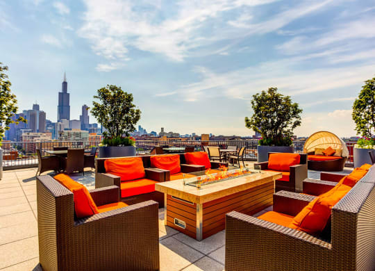 Rooftop deck with a fire pit, lounge area and skyline views at The Madison at Racine, Illinois, 60607