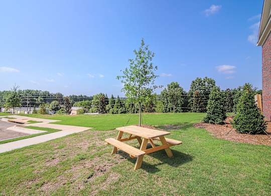 Enjoy the outdoors with charming community spaces featuring picnic seating.