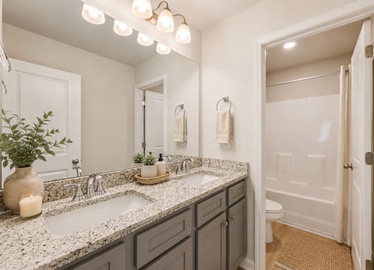 Secondary suite bathroom with a tub and shower combination