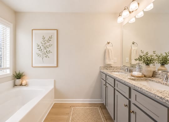 Elegant en suite with a double vanity off the primary bedroom.