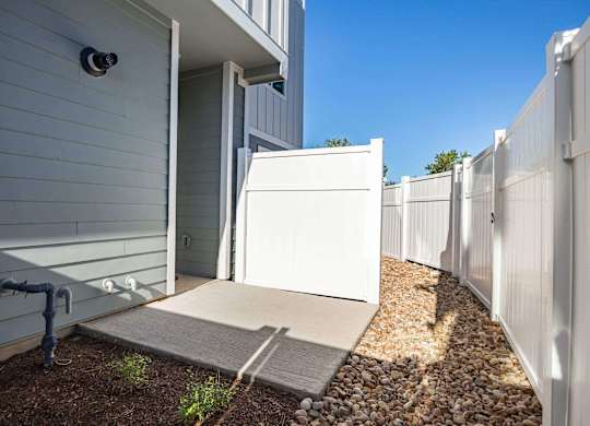 Beautifully Decorated Backyard with fence at Villae ATX Luxury Rental Townhomes, Texas